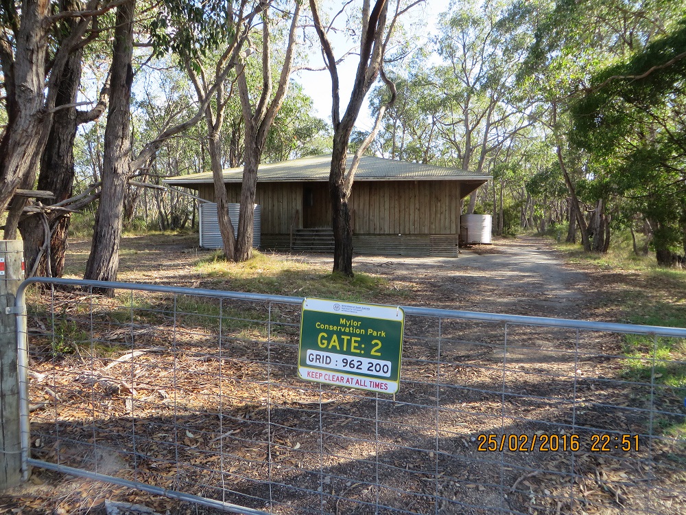 Gate 2 sign and camp