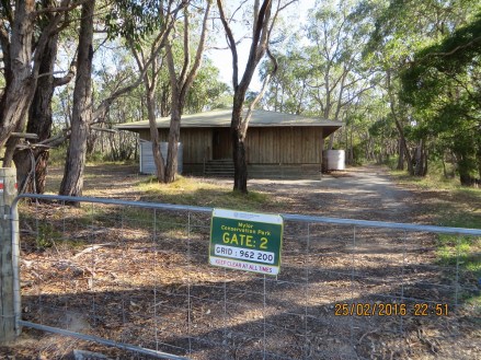 Gate 2 sign and camp